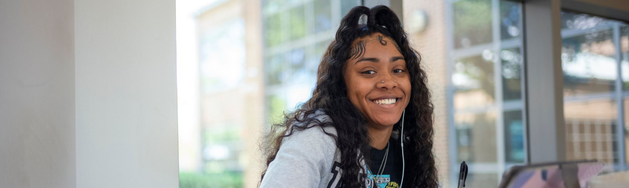 A close-up of a student smiling.