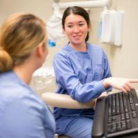 Dental Hygiene students in scrubs